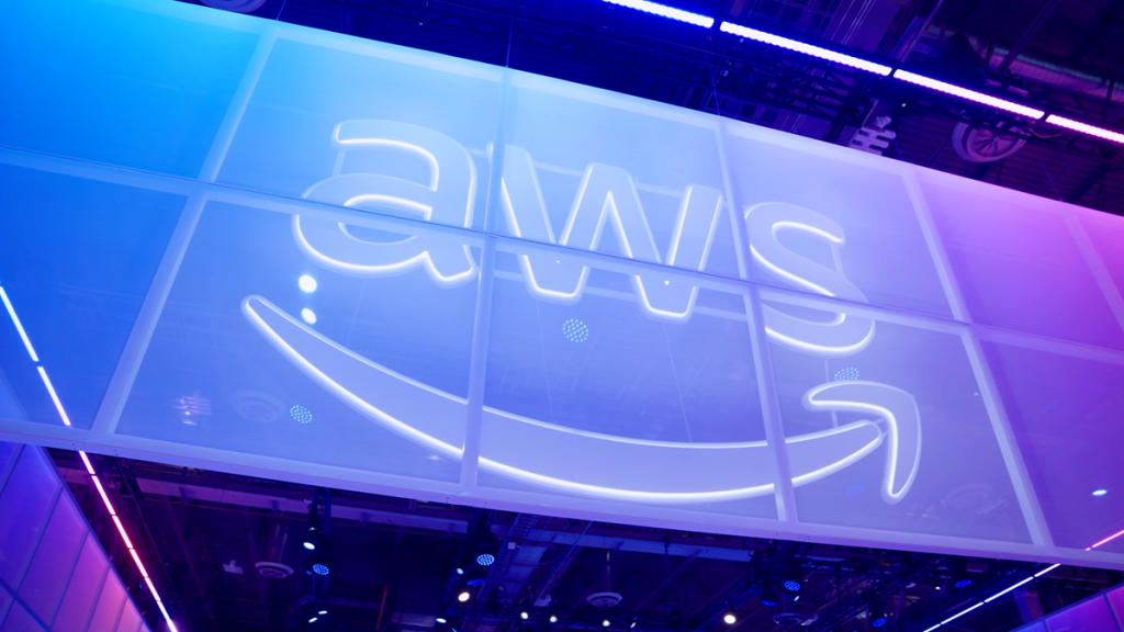 Illuminated AWS event sign in an official re:Invent promotional photograph